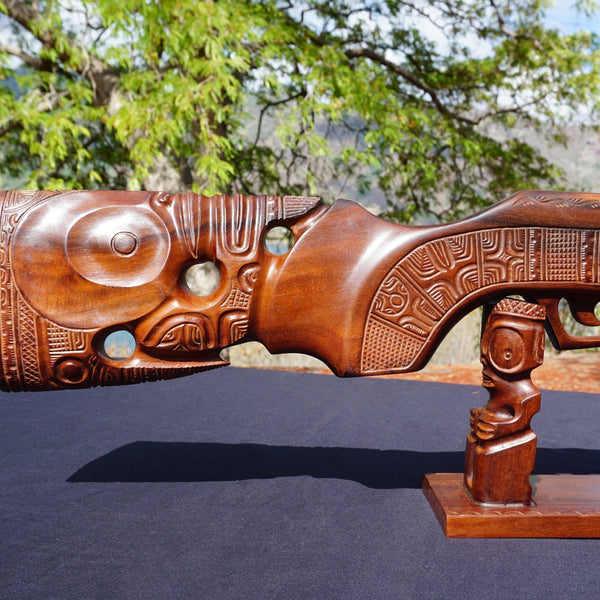 Hunting rifle on a pedestal - Cannibal Art