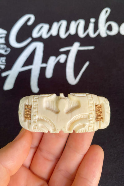 Hand-carved Etua bone bracelet with two Tikis, made in Nuku Hiva